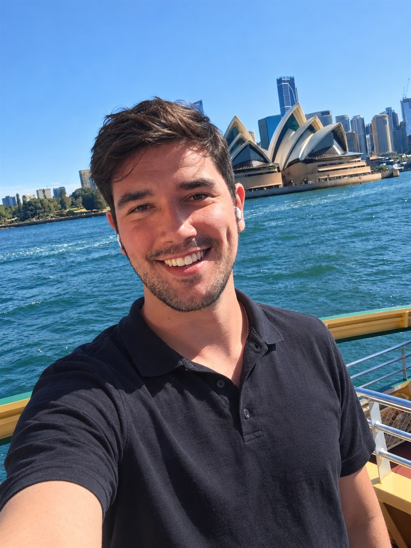 Christopher Scott on Sydney Harbour with the Sydney Opera House in the background.